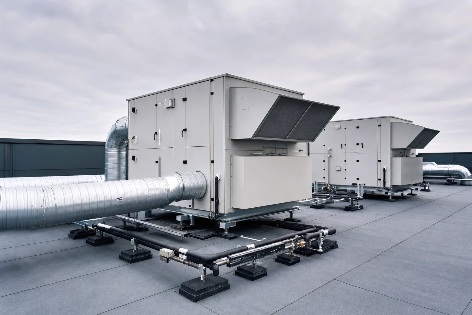 Packaged rooftop air handling units with insulated ductwork and refrigerant piping